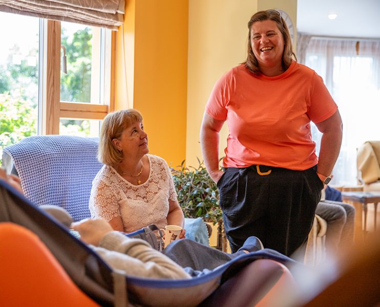 Photo of nurse smiling with resident