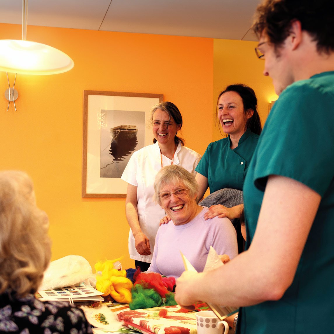 Photo of resident happy with nurses
