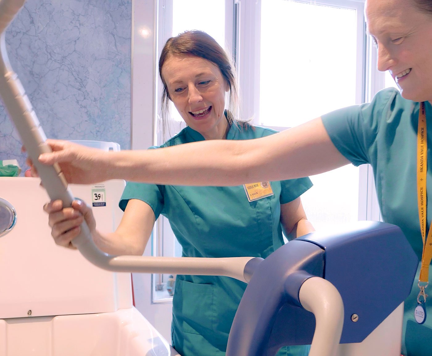 Carers training in moving and handling with a hoist at Skanda Vale Hospice