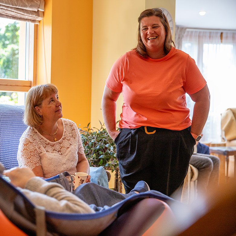 Photo of nurse smiling with resident