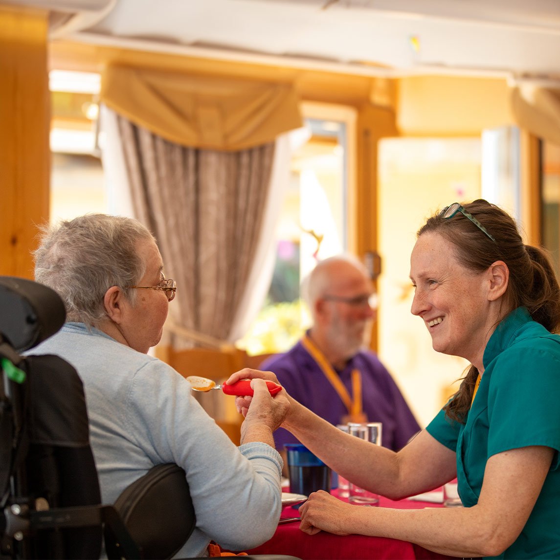 Photo of nurse helping nurse resident