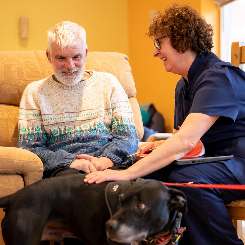Volunteer sitting with patients.